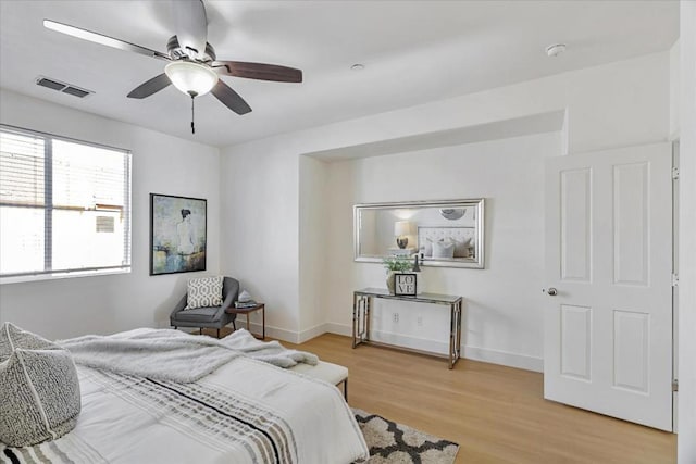 bedroom featuring light hardwood / wood-style floors and ceiling fan