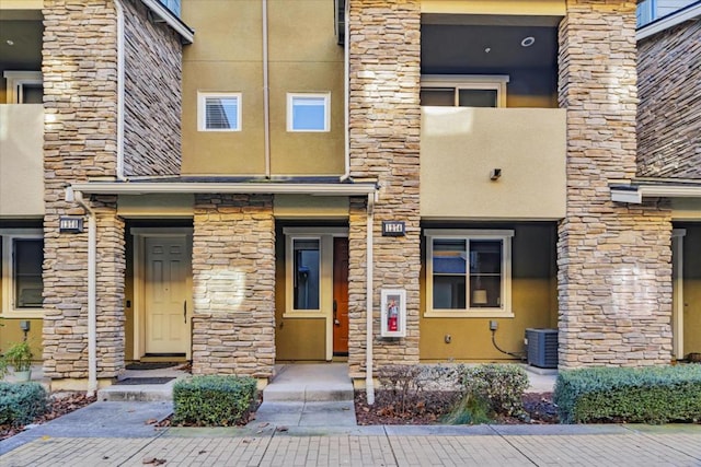 property entrance with central AC unit