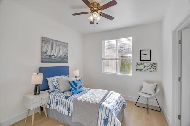 bedroom featuring ceiling fan and light hardwood / wood-style floors