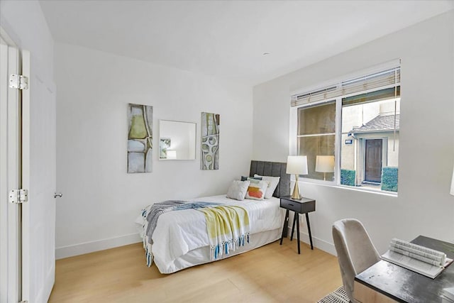 bedroom with hardwood / wood-style floors