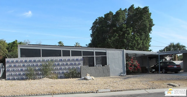 view of front of property with a carport