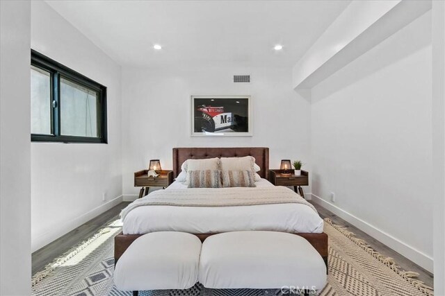 bedroom featuring hardwood / wood-style flooring