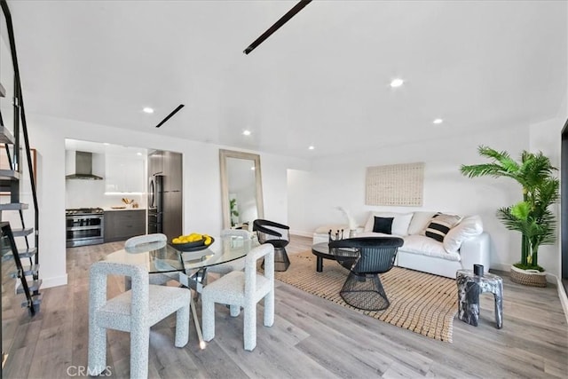 dining space featuring light hardwood / wood-style floors