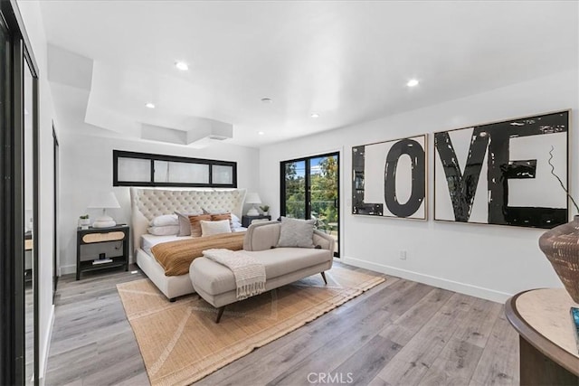 bedroom with light hardwood / wood-style flooring