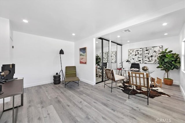 dining space with light wood-type flooring