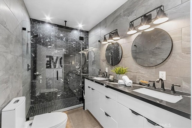 bathroom with vanity, tile walls, an enclosed shower, and toilet