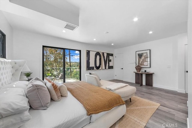 bedroom with access to outside and light hardwood / wood-style floors