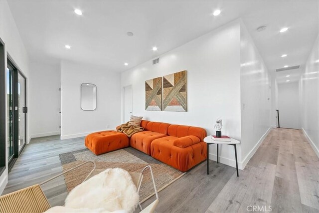 living room with light hardwood / wood-style floors