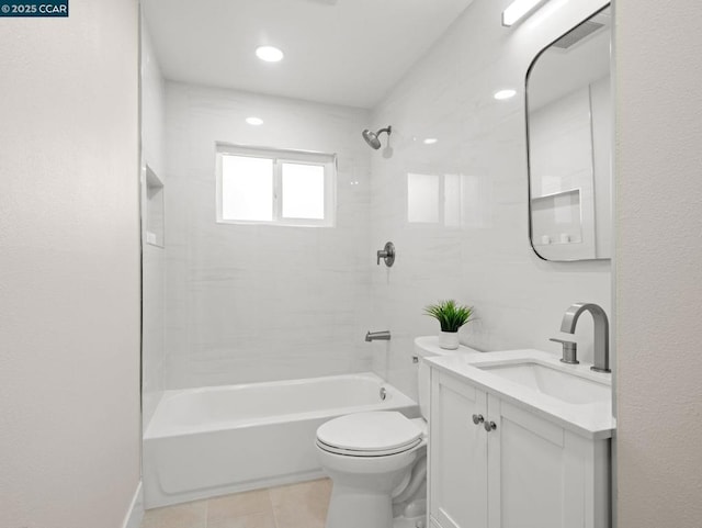 full bathroom with tiled shower / bath, vanity, toilet, and tile patterned flooring