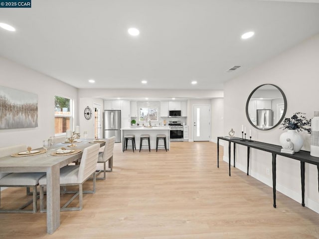 dining space featuring light hardwood / wood-style flooring