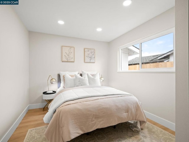 bedroom with light hardwood / wood-style flooring