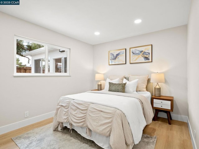 bedroom with hardwood / wood-style floors