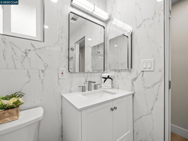 bathroom with vanity and toilet