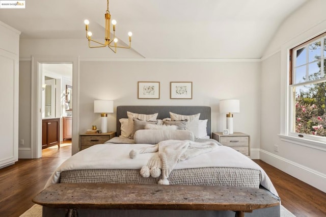 bedroom featuring vaulted ceiling, an inviting chandelier, and dark hardwood / wood-style flooring