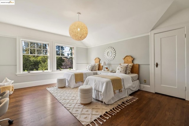 bedroom with hardwood / wood-style flooring and vaulted ceiling