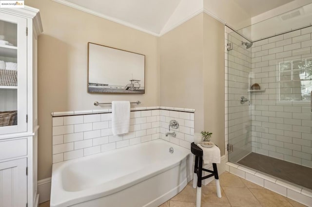 bathroom featuring tile patterned floors, ornamental molding, and independent shower and bath