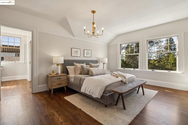 bedroom with dark hardwood / wood-style flooring, vaulted ceiling, and a notable chandelier