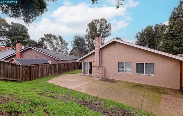 exterior space featuring a yard and a patio area