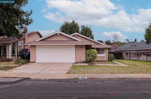 single story home with a garage and a front yard