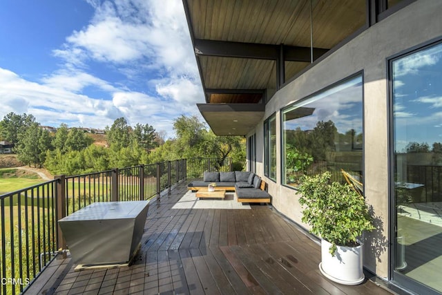 wooden deck featuring an outdoor living space