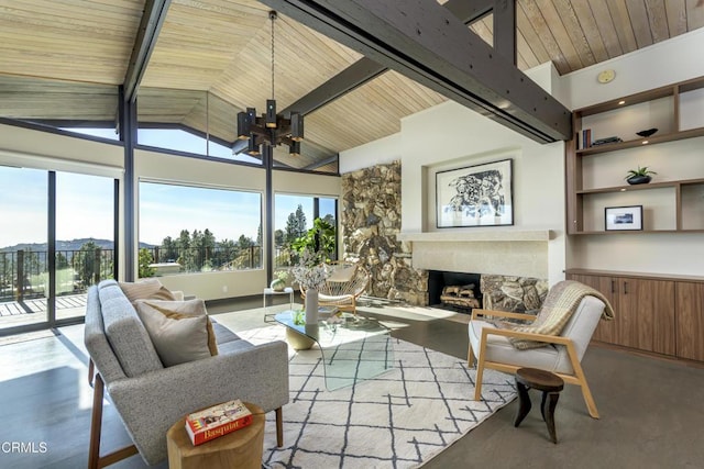 living room with wood ceiling, beamed ceiling, and a healthy amount of sunlight