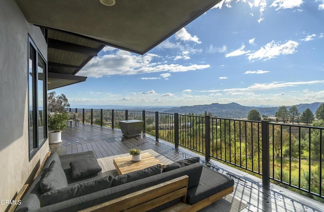 balcony featuring a mountain view