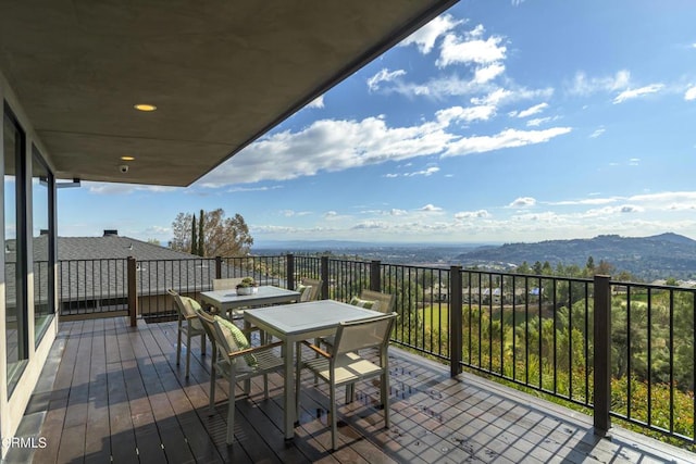 wooden terrace with a mountain view