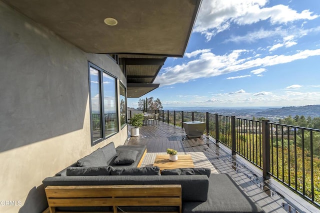 exterior space with a wooden deck and an outdoor hangout area