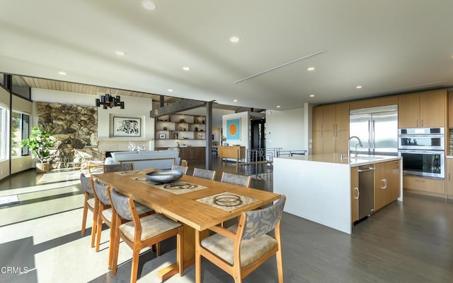 dining area with dark hardwood / wood-style flooring and sink