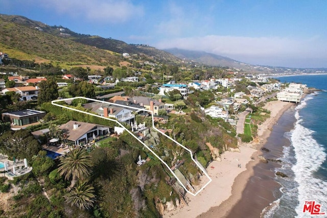 birds eye view of property featuring a beach view and a water and mountain view