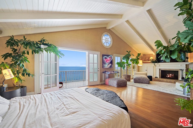 bedroom featuring hardwood / wood-style flooring, a water view, access to outside, french doors, and beamed ceiling