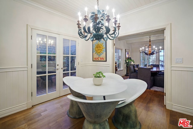 dining area featuring crown molding, hardwood / wood-style flooring, french doors, and a chandelier