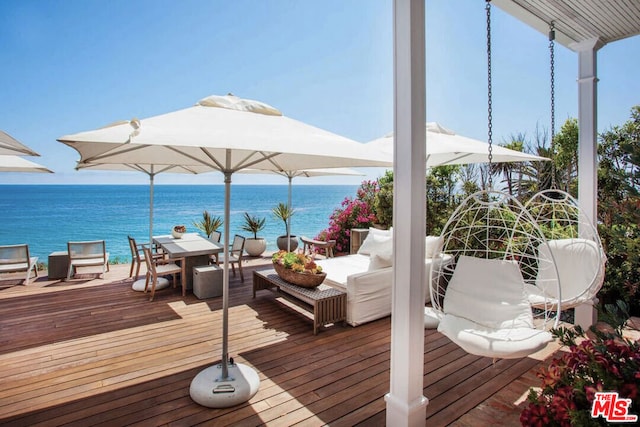 wooden deck featuring a water view