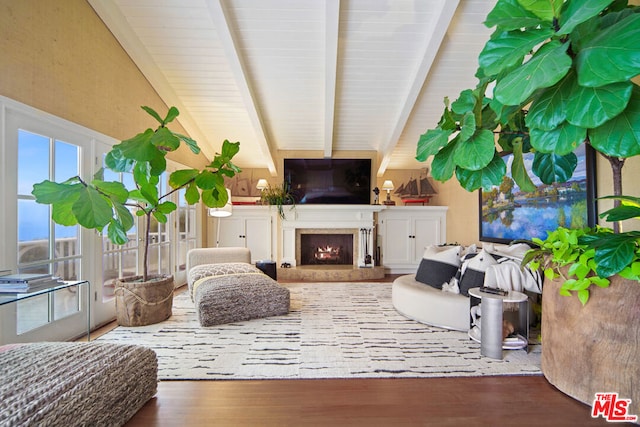 living room with hardwood / wood-style floors and beamed ceiling