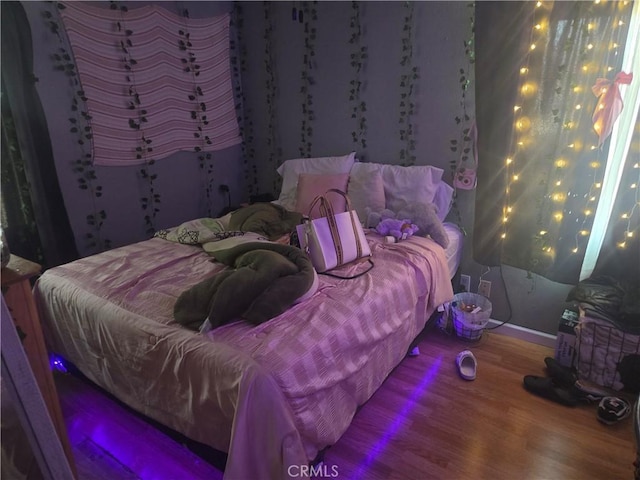 bedroom featuring hardwood / wood-style flooring