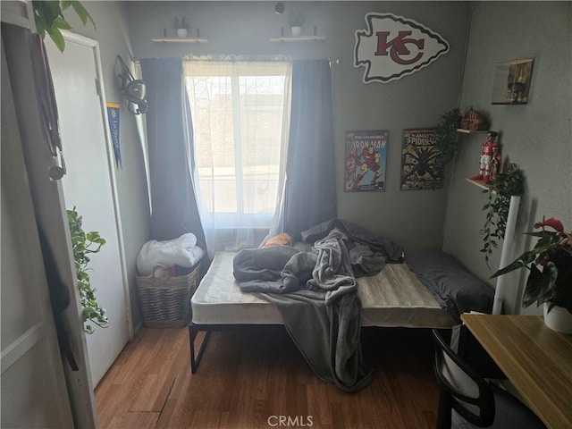 bedroom featuring hardwood / wood-style flooring