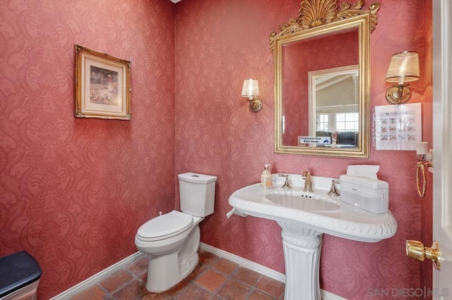 bathroom with tile patterned floors and toilet