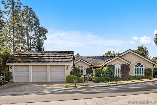 ranch-style home with a garage