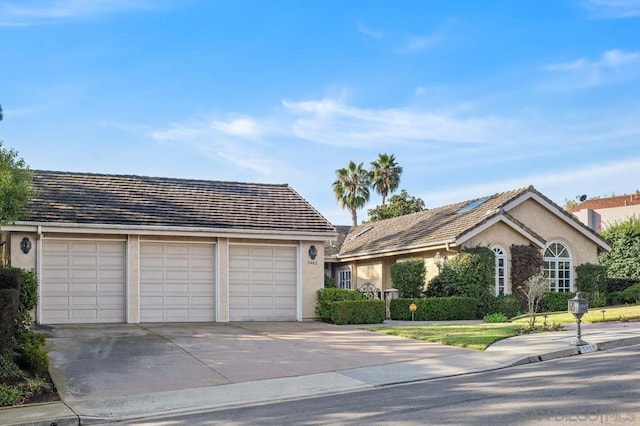 single story home with a garage