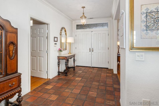 entrance foyer featuring ornamental molding