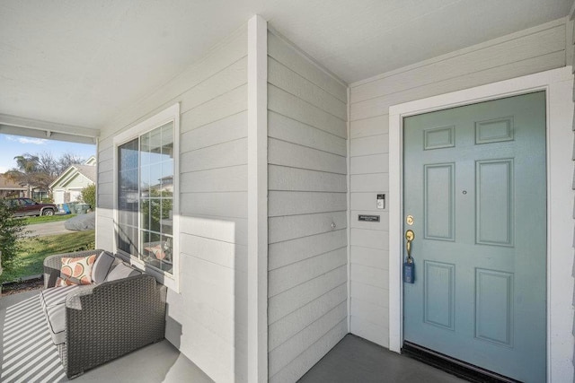 doorway to property with covered porch