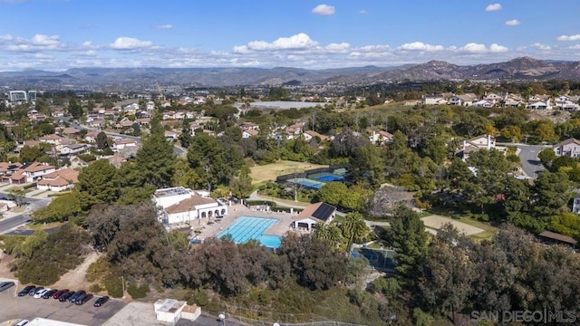 birds eye view of property featuring a mountain view