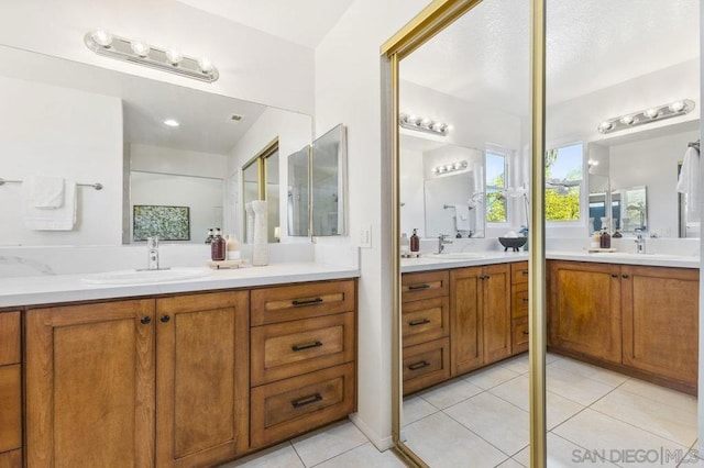 bathroom with vanity and tile patterned floors