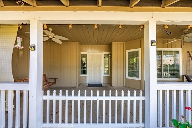 doorway to property featuring ceiling fan