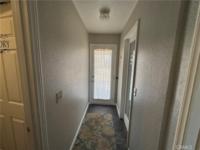 entryway with a textured ceiling