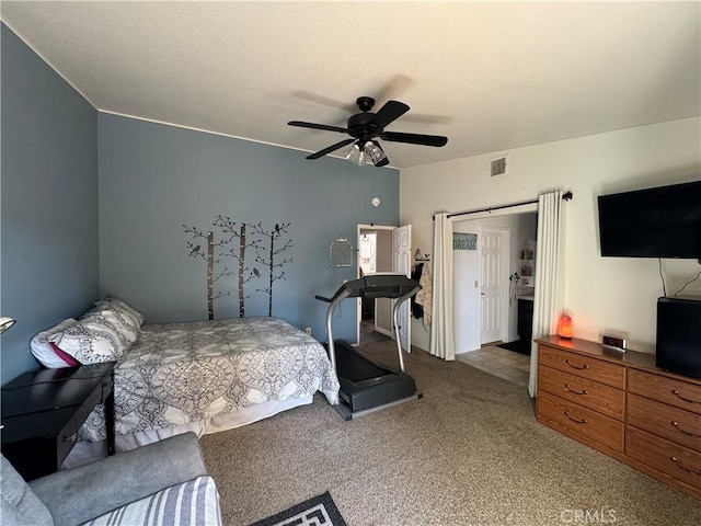 bedroom featuring ceiling fan and carpet flooring