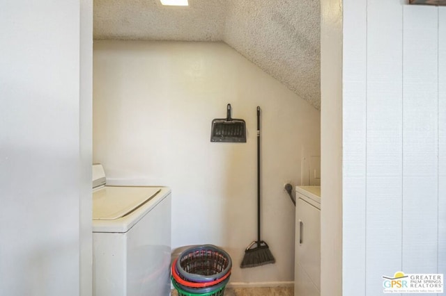 washroom featuring separate washer and dryer and a textured ceiling