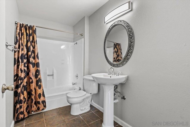 bathroom with toilet, tile patterned floors, and shower / bathtub combination with curtain