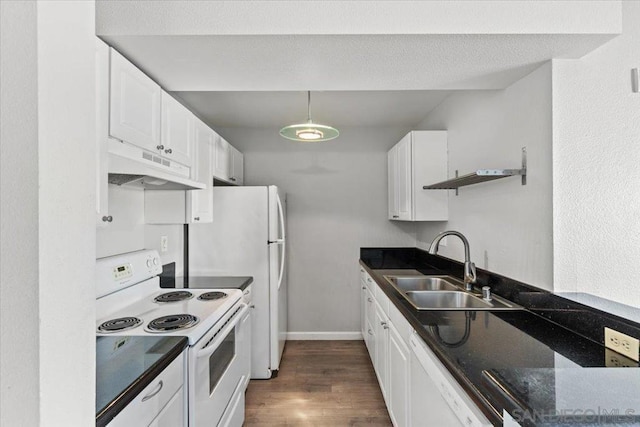 kitchen featuring sink, white appliances, dark wood-type flooring, and white cabinets