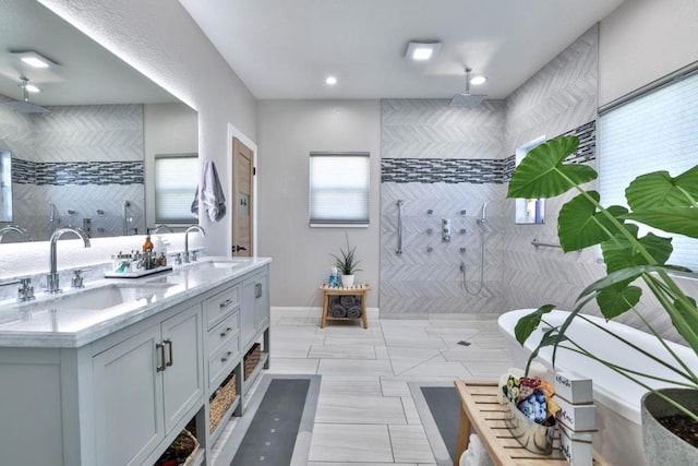 bathroom featuring vanity and tiled shower